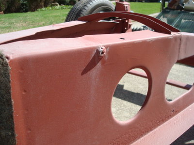 weird welded bung on chassis 1.JPG and 